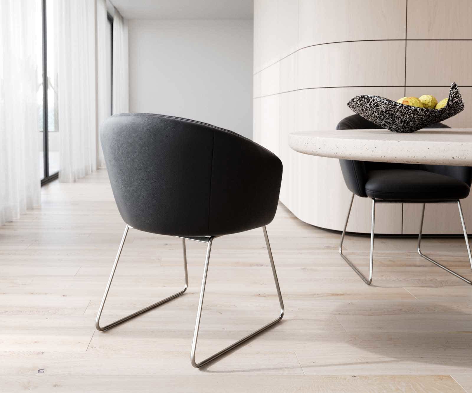Chaise-de-salle-à-manger Caja-Flex avec accoudoirs cuir de vache noir pied trapèze acier inoxydable brossé ressorts ensachés 4 Chaise-de-salle-à-manger Caja-Flex avec accoudoirs cuir de vache noir pied trapèze acier inoxydable brossé ressorts ensachés 4