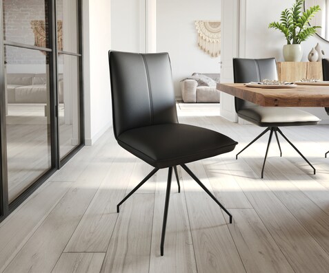 Chaise-de-salle-à-manger Lelio-Flex cuir de vache noir pied croisé conique noir ressorts ensachés