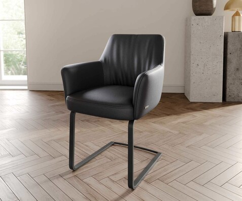 Cantilever Xana-Flex avec accoudoirs cuir de vache noir pied cantilever plat noir ressorts ensachés