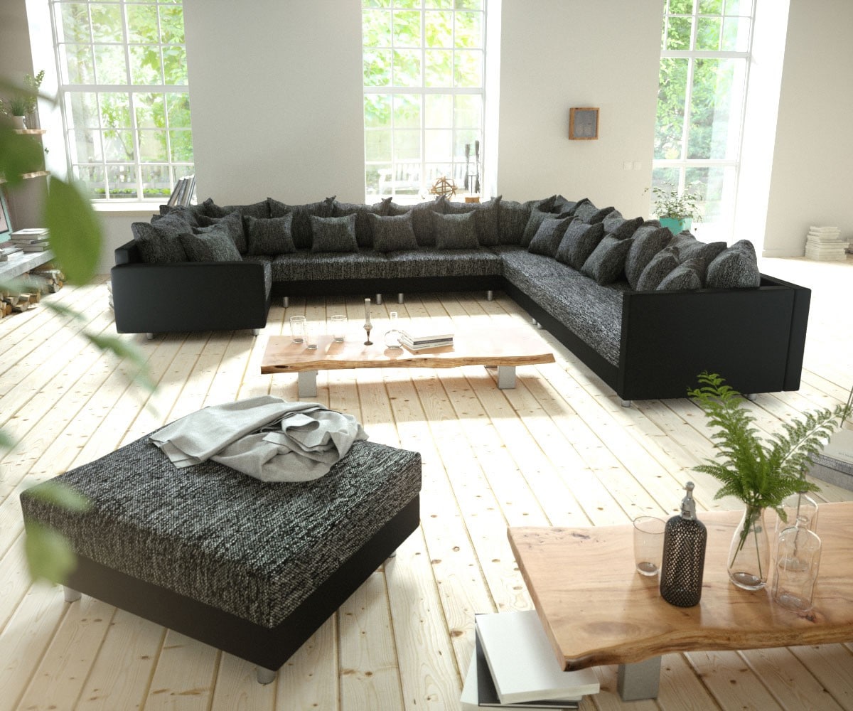 Canapé-panoramique Clovis XXL modulable noir avec tabouret et accoudoirs poufs droite 1